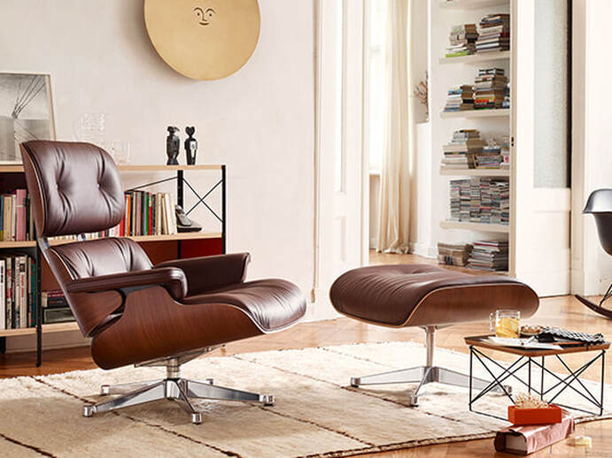 Poltrona Eames Lounge Chair and Ottoman da Vitra com pele castanha